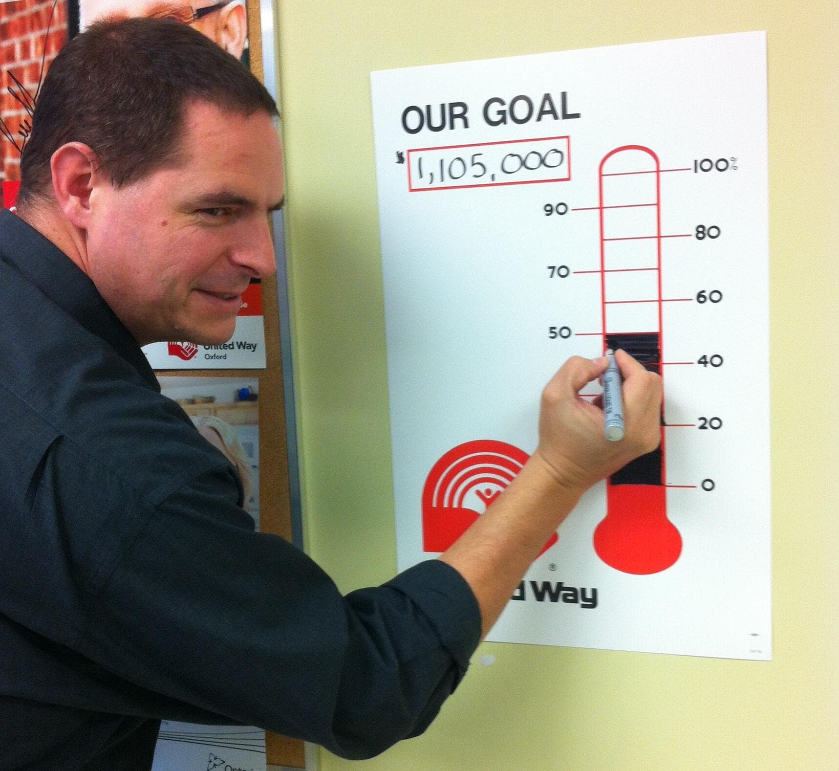 Jay Friesen as United Way Oxford sponsored employee updating fundraising goal tracker